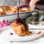 Easy Baked Vanilla French Toast with Berry Sauce is a dream brunch! Easy to prep, smells heavenly in the oven, and tastes is crazy delicious! #brunch #frenchtoast
