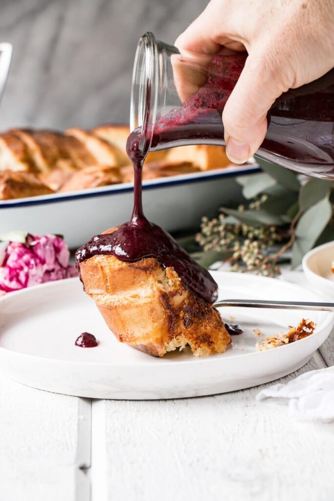 Easy Baked Vanilla French Toast with Berry Sauce is a dream brunch! Easy to prep, smells heavenly in the oven, and tastes is crazy delicious! #brunch #frenchtoast