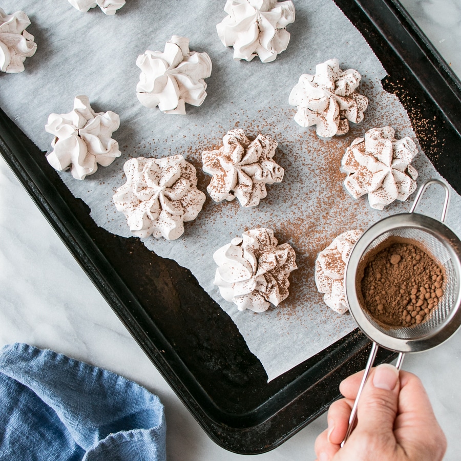 Chocolate Meringue Cookies with a dusting of cocoa powder.