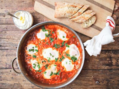Shakshuka is eggs poached in a tomato sauce. It's a splendid breakfast that will have you soaking up the sauce with bread! #eggs #breakfast #poachedeggs