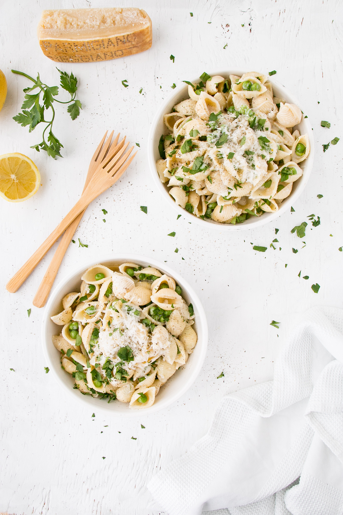 Lemon Pepper Alfredo with Peas in white bowls