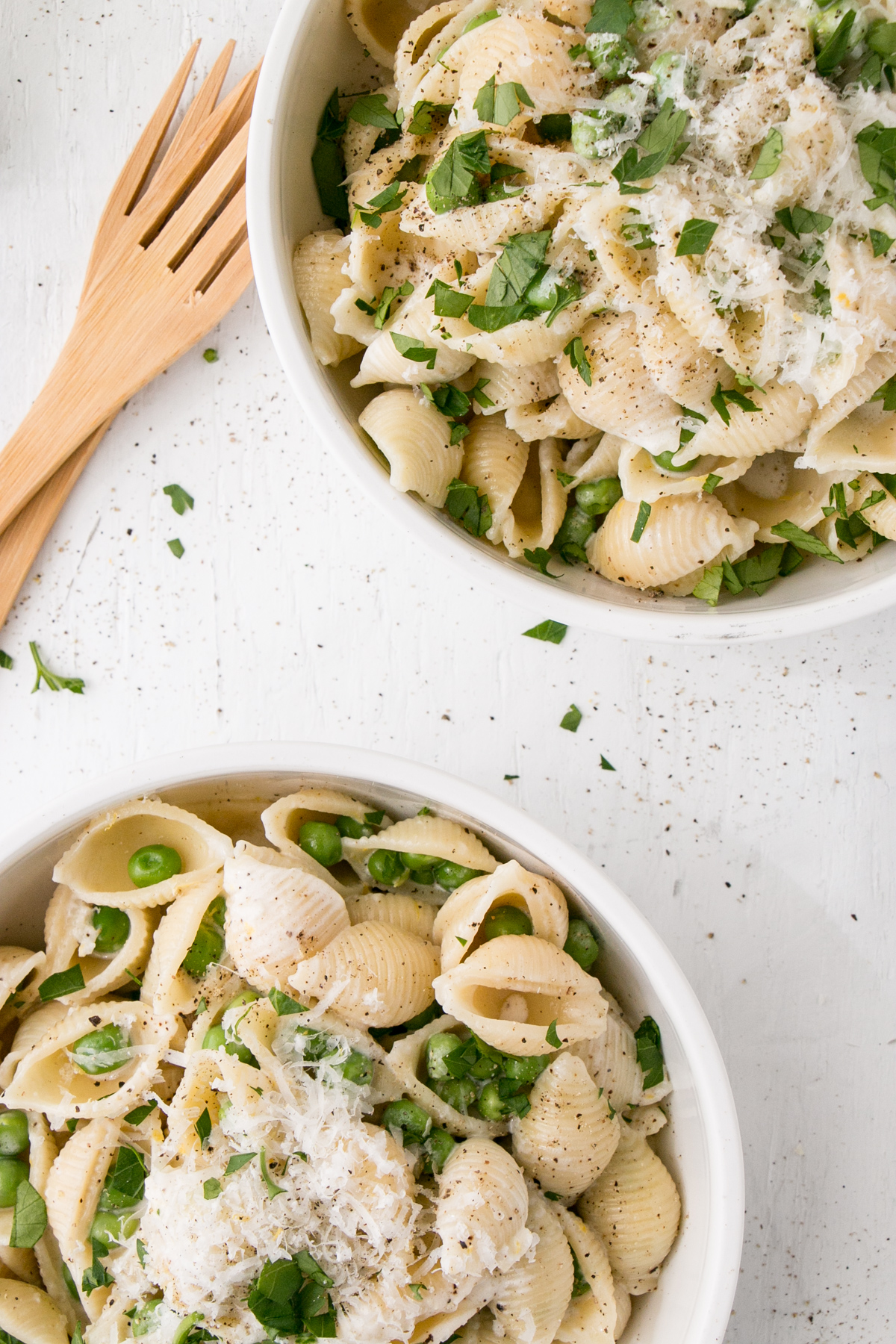 Lemon Pepper Alfredo with Peas in white bowls 