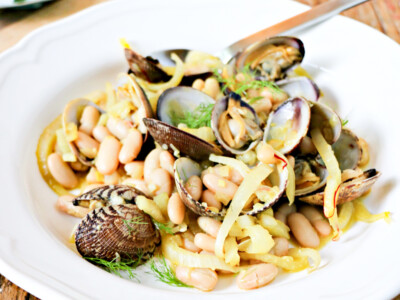 Saffron Clams & Fennel with White Beans in a white bowl