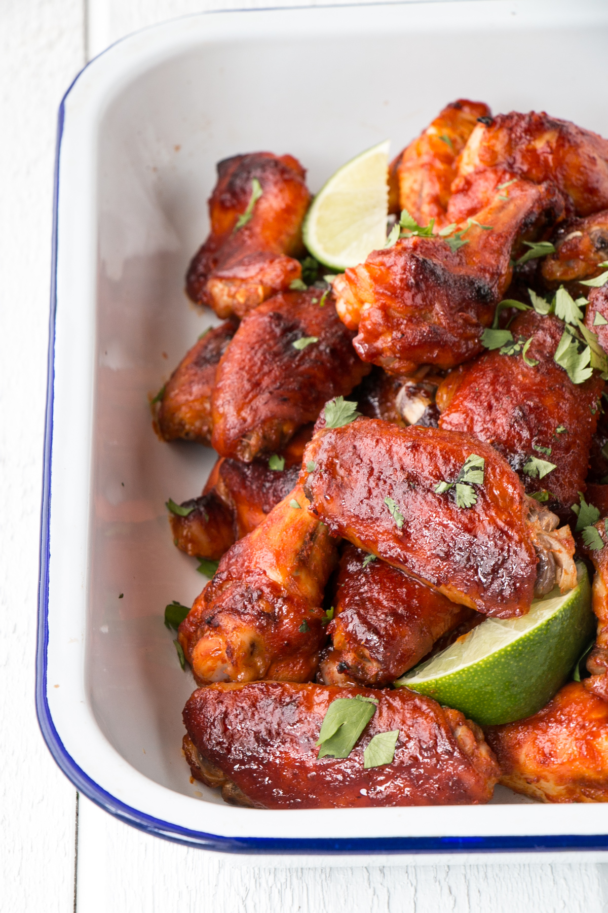 gochujang hot wings in a white serving tray 