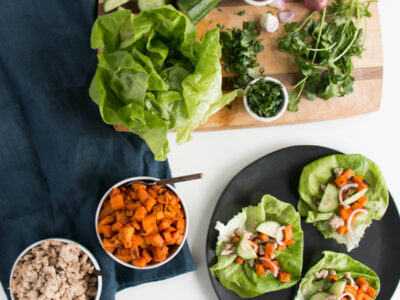 Light, vibrant, and scrumptious Sweet Potato Lettuce Wraps! Delicious Thai Peanut Sweet Potatoes, Chicken, and Pickled Shallots for a refreshing and satisfying meal.  #lettucewraps #healthy #sweetpotatoes