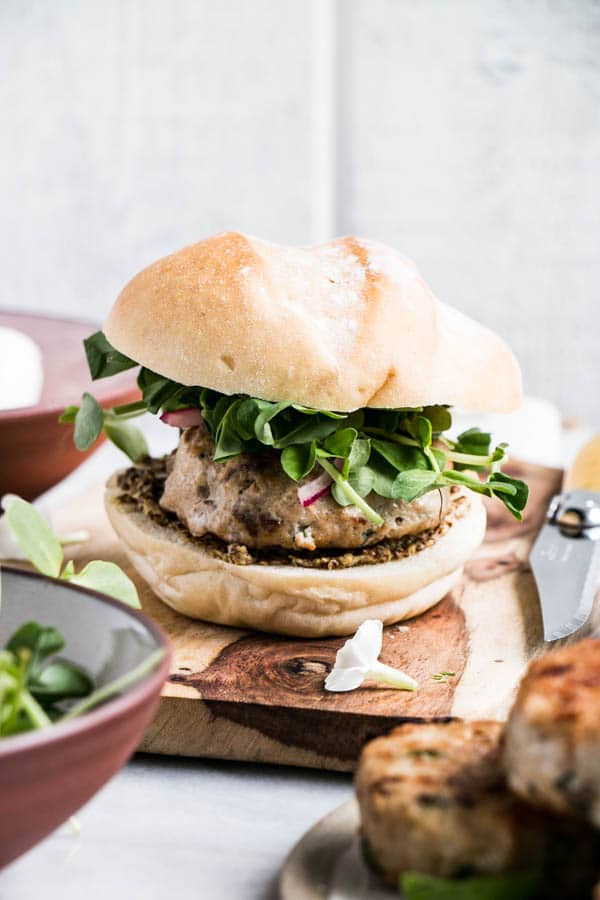 Caprese Chicken Burgers | My Kitchen Love. Obscenely delicious, juicy caprese burgers with a cheesy boccocini centre, lots of basil, and sundried tomatoes.