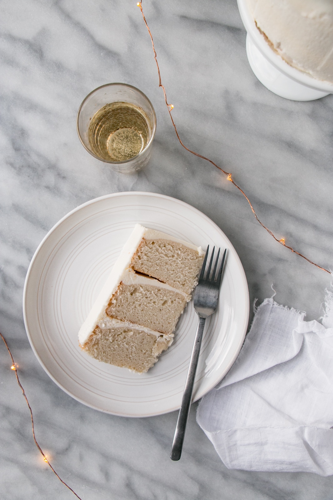 This Champagne Vanilla Bean Layer Cake is perfect to celebrate the holidays or any birthday! #cake #birthday #champagne