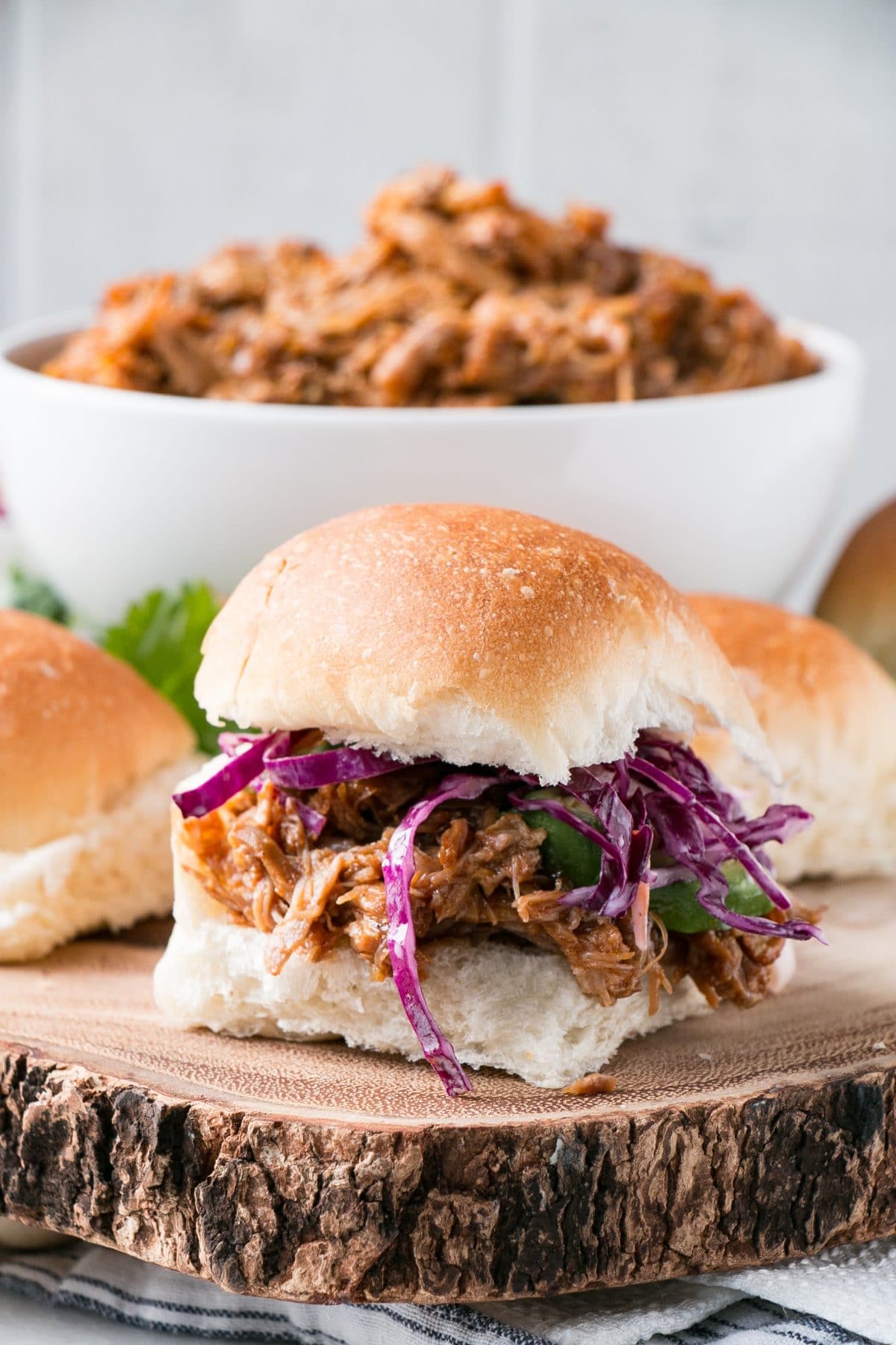 This is the BEST BBQ Pulled Pork with a mouthwatering BBQ sauce and instructions for Instant Pot and Slow Cooker. #instantpot #pulledpork #slowcooker