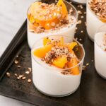Peach Yogurt Panna Cotta with Cinnamon Granola is a dreamy make ahead breakfast that is perfect for entertaining, Mother's Day, Valentine's Day or anytime you need a special treat for breakfast! #ad #breakfast #mothersday #valentinesday #pannacotta