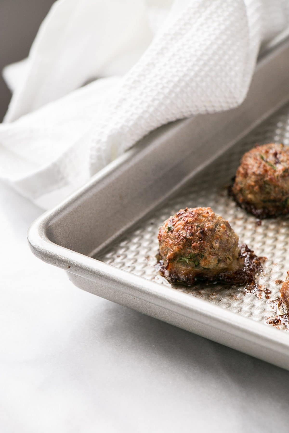 Mini Lamb Meatballs are a quick and easy way to bake juicy and tasty meatballs for dinner! Serve with yogurt and cucumber salad for a refreshing supper! #meatballs #lambs #dinner #weekdaydinner