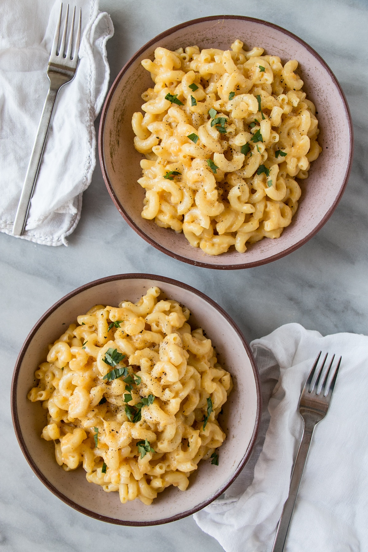 Instant Pot Mac and Cheese in two bowls with forks. 