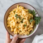 Instant Pot Mac and Cheese with Lentils in a pink bowl.