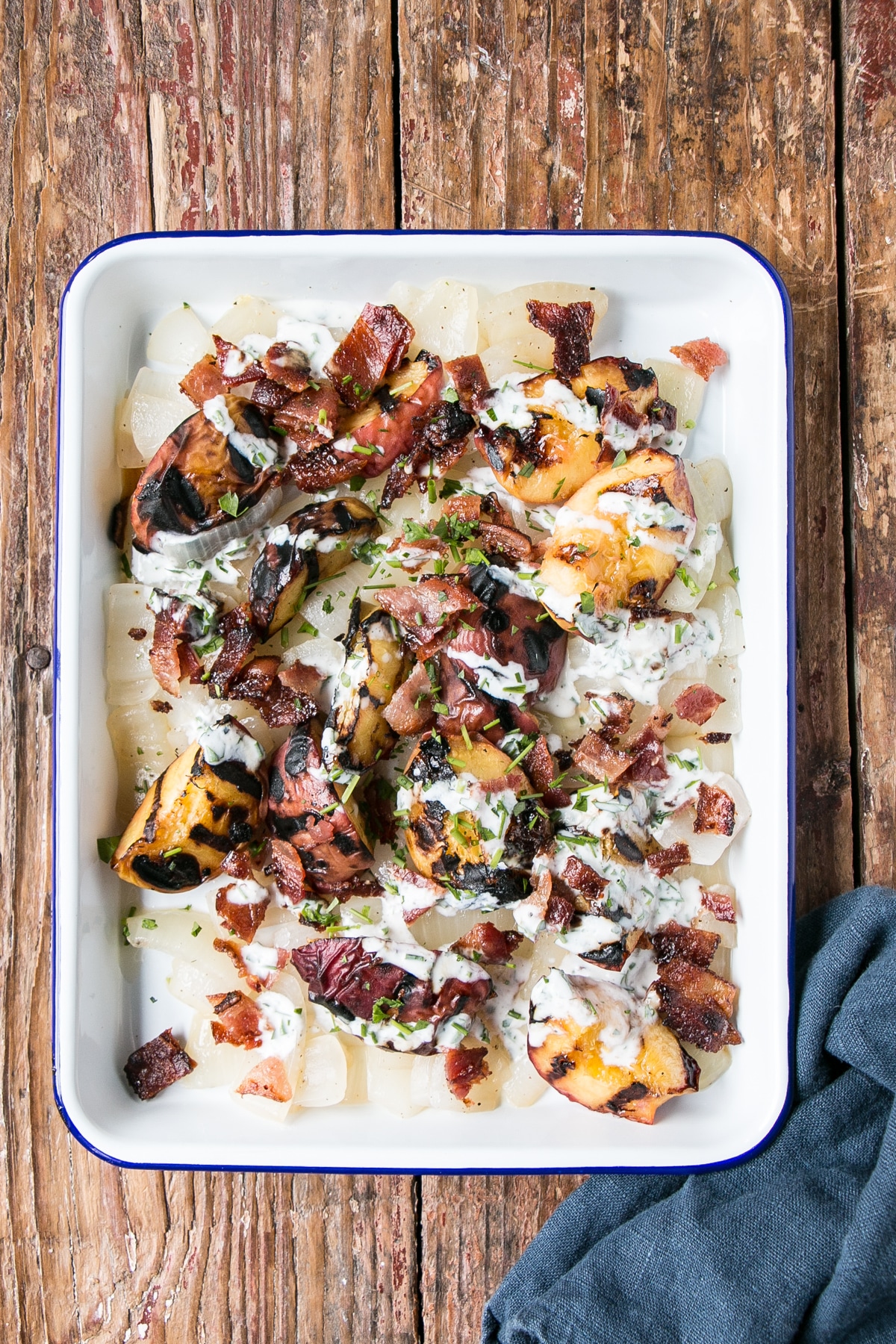 Grilled Peach, Onion and Bacon Salad on a serving tray.