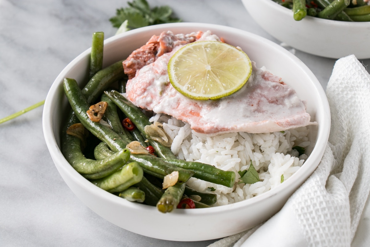 Coconut Lime Salmon with coconut rice and spicy green beans in a bowl