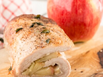 Apple and Brie Pork Tenderloin with an apple in the background