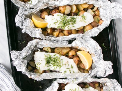 Cod, Chorizo and Potato Foil Packets on a baking tray