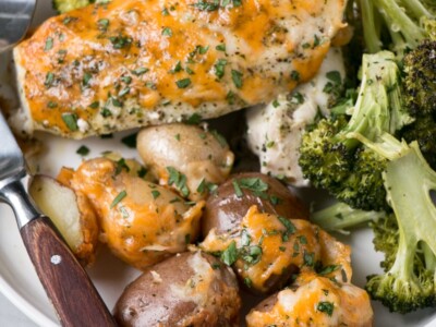 Cheesy Chicken and Potato Bake with broccoli on a plate