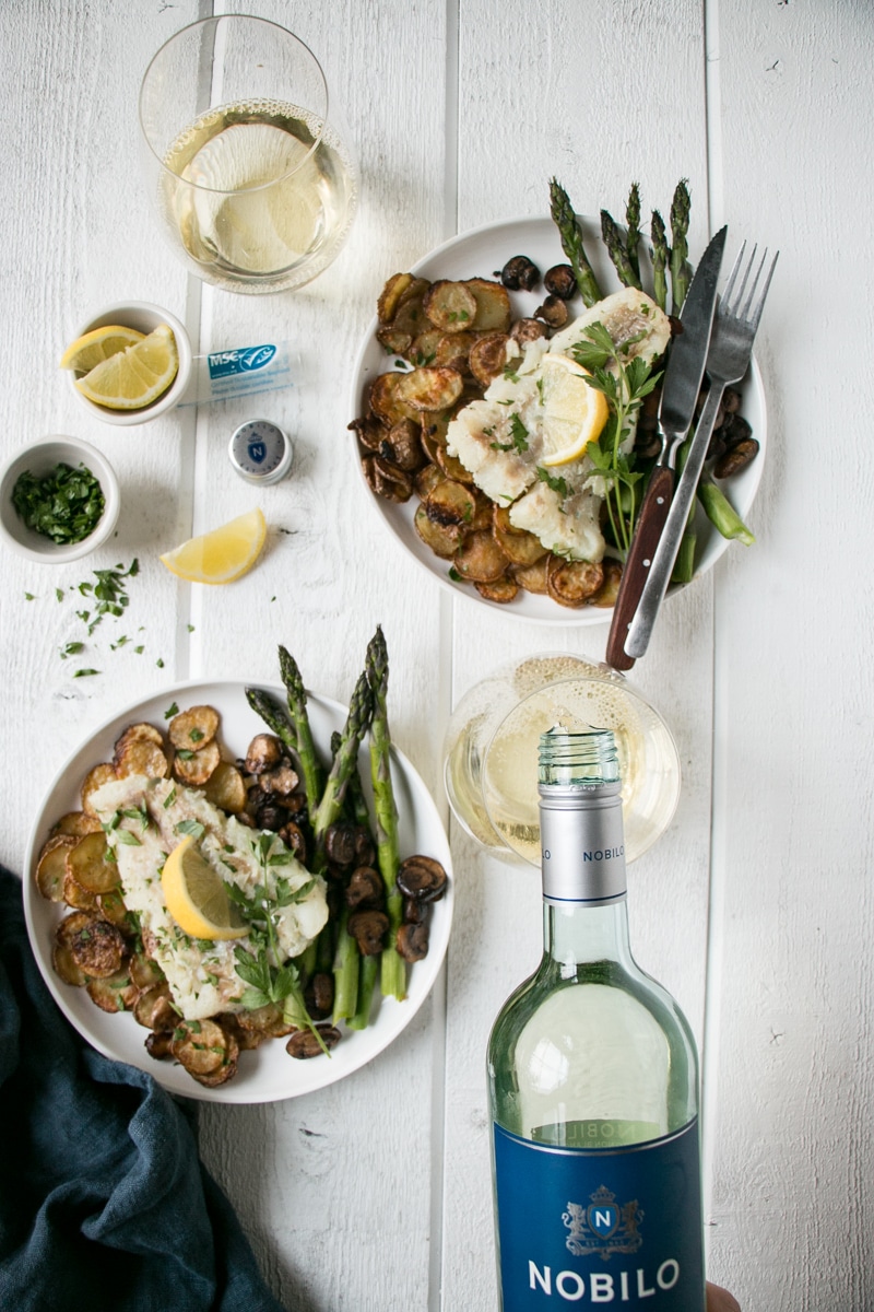 Pan Fried Cod served with potatoes, asparagus and mushrooms.