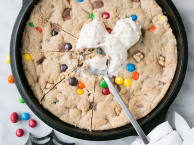Halloween Candy Skillet Cookie with ice cream on top.