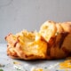 Pull Apart Cheese Bread with gooey cheese being pulled between layers.